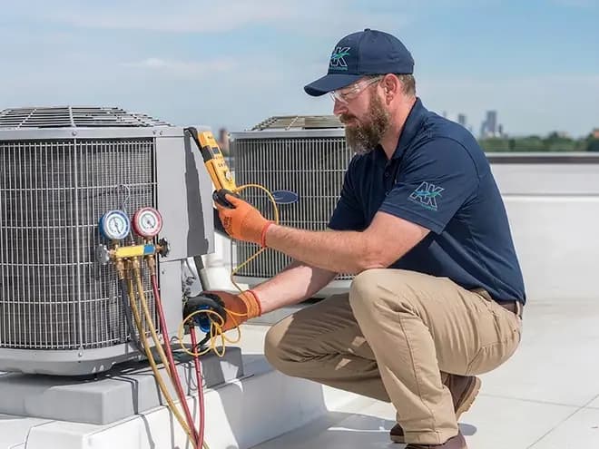 AK Water Works HVAC technician performing heating and cooling service
